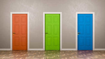 three different colored doors next to each other in the same hallways