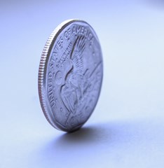 a coin balanced on its side