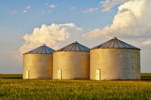 silos in a grass field