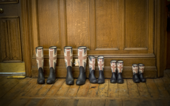 Different sizes of British flag boots lined up