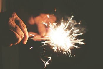 someone holding a sparkler