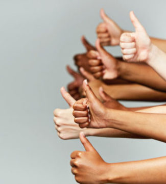 a group of people giving a thumbs up